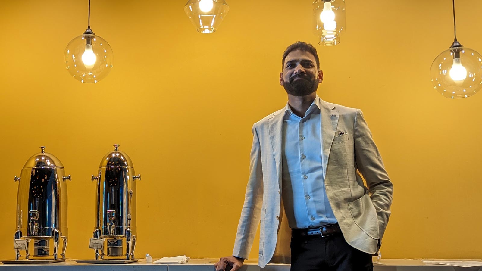 Pramod Jain, CEO, Computer Modelling Group, watches as startups pitch investors at ATCE in San Antonio. – Photo by ACCELERATE