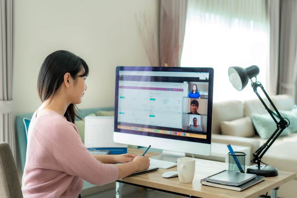 Woman in a virtual meeting on her computer